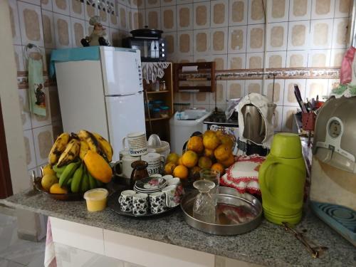 a kitchen counter with a bunch of fruit on it at Casa de Elvira in Belém