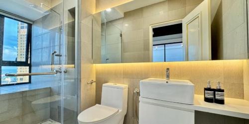 a bathroom with a toilet and a sink and a mirror at Jacuzzi with Starry Sky Bedroom-7pax in Malacca