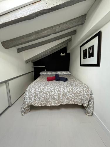 a bedroom with a bed in a white room at APARTAMENTOS URDAIBAI 5 in Bermeo
