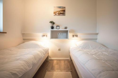 Ένα ή περισσότερα κρεβάτια σε δωμάτιο στο Deichkoje 6 Dagebüll