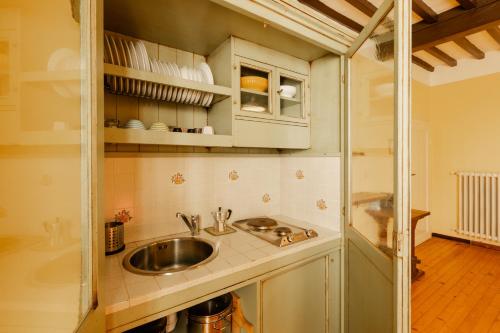 a kitchen with a sink and a counter at Fattoria di Germagnano in Sansepolcro