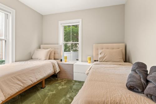 Giường trong phòng chung tại Cozy 2 Bed Apt