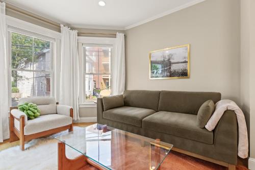 a living room with a couch and a glass table at Cozy 2 Bed Apt in Cambridge