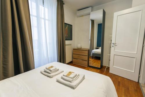 Postel nebo postele na pokoji v ubytování Casa Stella Charme nel Quadrilatero Romano