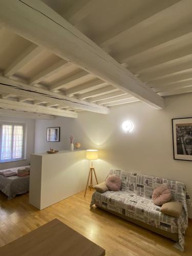 a living room with a couch and a table at Ganaceto54 in Modena