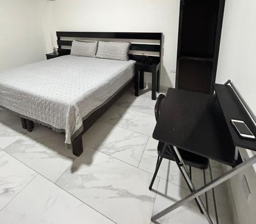 Postel nebo postele na pokoji v ubytování HOTEL and Suites Cananea