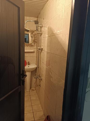 a small bathroom with a sink and a toilet at Simge Suite Hotel in Istanbul