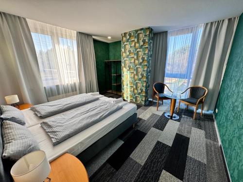 Ένα ή περισσότερα κρεβάτια σε δωμάτιο στο Parkhotel Viktoria