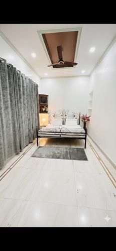 a bedroom with a bed in a room at Krishna guest house in Varanasi