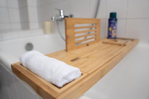 a bathroom counter with a white towel on it at Apartment Lebenslang - Nähe Weserstadion & Viertel in Bremen