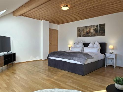 Ένα ή περισσότερα κρεβάτια σε δωμάτιο στο Rost Apartments - Staffelsee