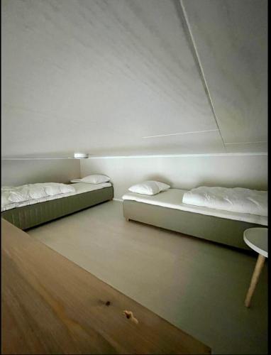 Ένα ή περισσότερα κρεβάτια σε δωμάτιο στο vaaranhuoneistot