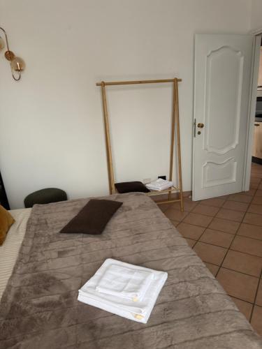 Un pat sau paturi într-o cameră la Belloro