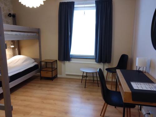 Postel nebo postele na pokoji v ubytování Avavikens Vandrarhem och Konferens