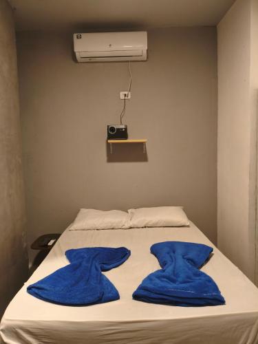 Ένα ή περισσότερα κρεβάτια σε δωμάτιο στο Suíte Encantos do Natal