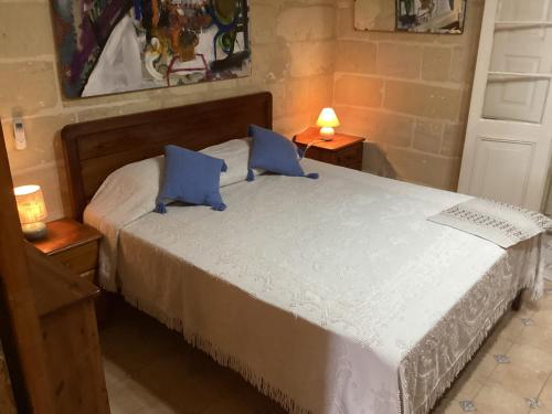 Ένα ή περισσότερα κρεβάτια σε δωμάτιο στο Blue Sunrise