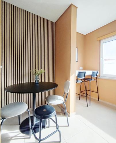 a dining room with a table and chairs at Douro Valley Private Terrace & Lounge in Armamar