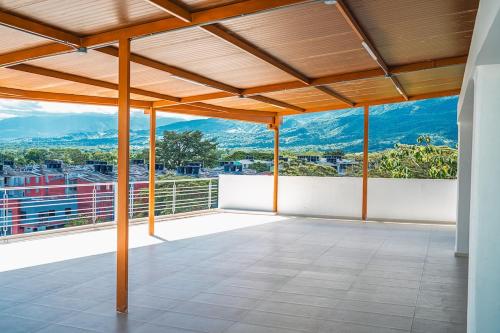 a roof deck with a view of mountains at Modern loft and parking ideal for couples in Acacías