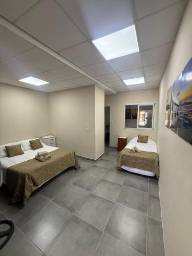 Postel nebo postele na pokoji v ubytování Dpto CORRIENTES, Planta BAJA