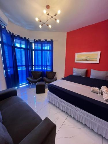 a living room with two beds and a couch at 958 Golden Flat Fortaleza in Fortaleza