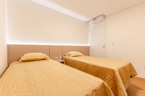 Postel nebo postele na pokoji v ubytování Apto Charmoso e Bem Localizado em Bombas