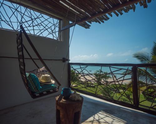 a room with a view of the beach and the ocean at Casa Babi in Vilanculos
