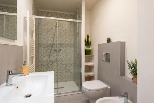a bathroom with a shower and a toilet and a sink at La Casina del Popi in Arezzo