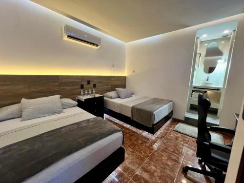 Postel nebo postele na pokoji v ubytování Eco-Hotel boutique Casa Solar Minatitlán