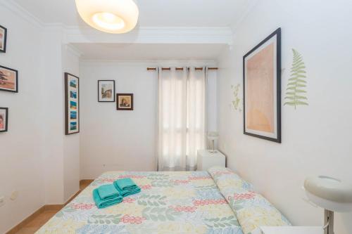 a bedroom with a bed and a sink at Playa Sardina Home with Pool in Sardina
