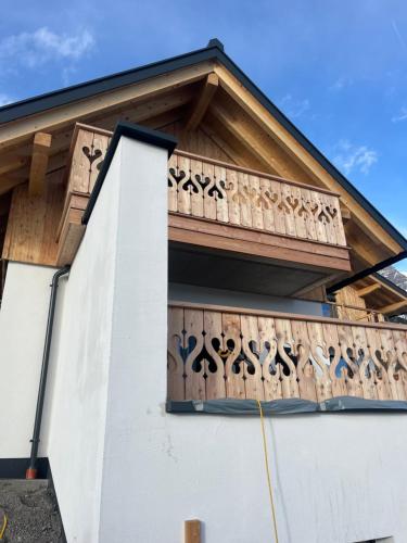 a balcony on the side of a house at Ferienhaus Korda in Ramsau am Dachstein