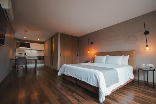 Postel nebo postele na pokoji v ubytování Sites Hotel