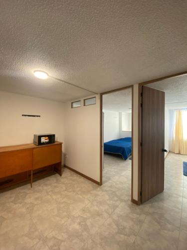 Ένα ή περισσότερα κρεβάτια σε δωμάτιο στο Apartamento 202 frente a UPTC