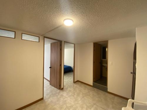 Ένα ή περισσότερα κρεβάτια σε δωμάτιο στο Apartamento 202 frente a UPTC