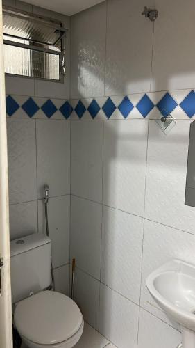 a bathroom with a toilet and a sink at Eds pousada in Juazeiro do Norte