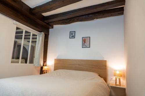 Postel nebo postele na pokoji v ubytování Charmant appartement alsacien au cœur de Rosheim