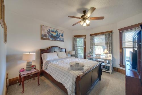a bedroom with a bed and a ceiling fan at Central Akron Stay! Large Victorian Home with Yard in Akron
