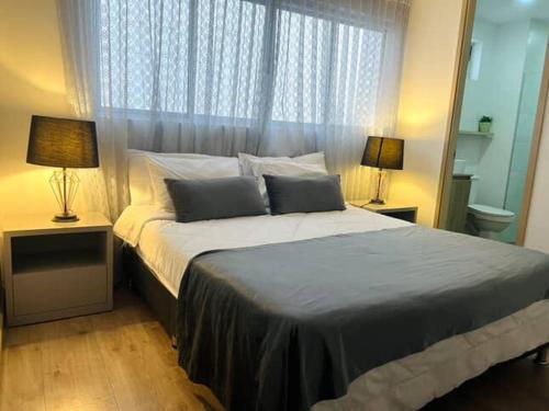 Ένα ή περισσότερα κρεβάτια σε δωμάτιο στο Impecable y lujoso apartamento para una estadía unica