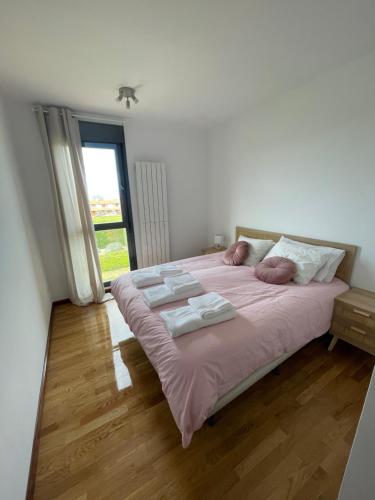 Ένα ή περισσότερα κρεβάτια σε δωμάτιο στο Casa acogedora golf Rioja alta