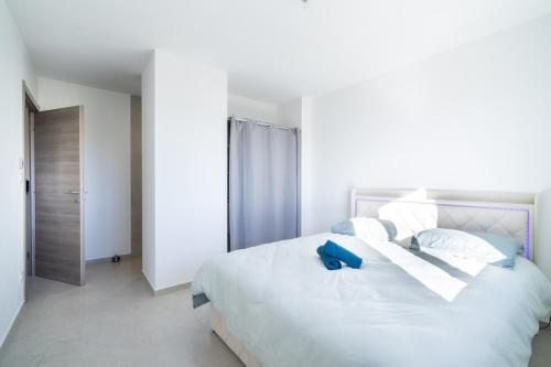 Postel nebo postele na pokoji v ubytování Villa spacieuse ambiance cosy près d'Arles Nîmes Avignon - jusqu'à 12 personnes