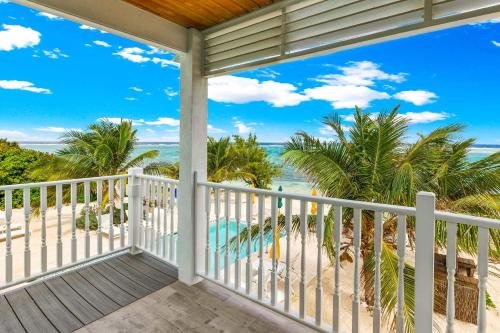 a balcony with a view of the beach at The Starfish at Cottages in Sand Bluff