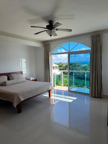 Postel nebo postele na pokoji v ubytování Cabarete Town House