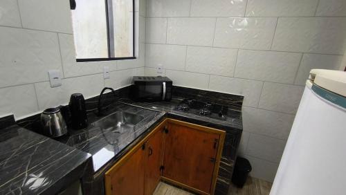 Η κουζίνα ή μικρή κουζίνα στο Casa tranquila no Santinho