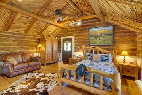 a bedroom with a bed in a log cabin at Unwind Poolside, Scenic Sonoran Desert Retreat! in Tucson