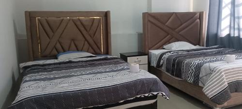 Ένα ή περισσότερα κρεβάτια σε δωμάτιο στο Hospedaje Paraíso