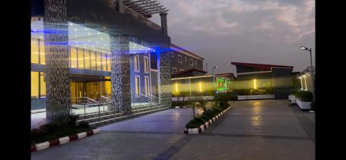 a building with blue lights on the side of it at Dreamz Hotel and Suites in Ogbomoso