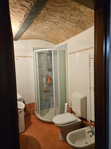 a bathroom with a shower and a toilet and a sink at Ani's home in Monfalcone