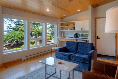 a living room with a couch and a table at Ocean House in Newport