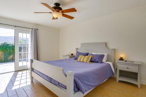 a bedroom with a bed and a ceiling fan at Family Home, 7 Mi to Joshua Tree National Park! in Twentynine Palms