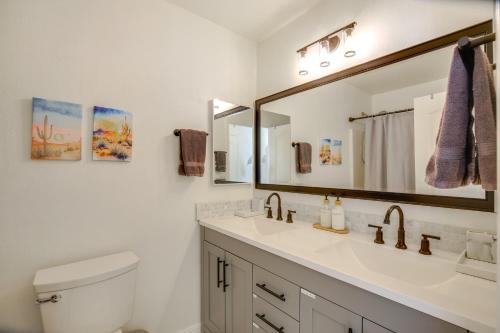 a bathroom with a sink and a mirror at Family Home, 7 Mi to Joshua Tree National Park! in Twentynine Palms