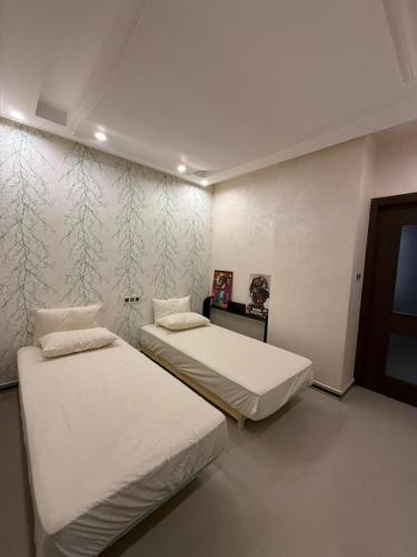 En eller flere senge i et værelse på 3-bedroom apartment